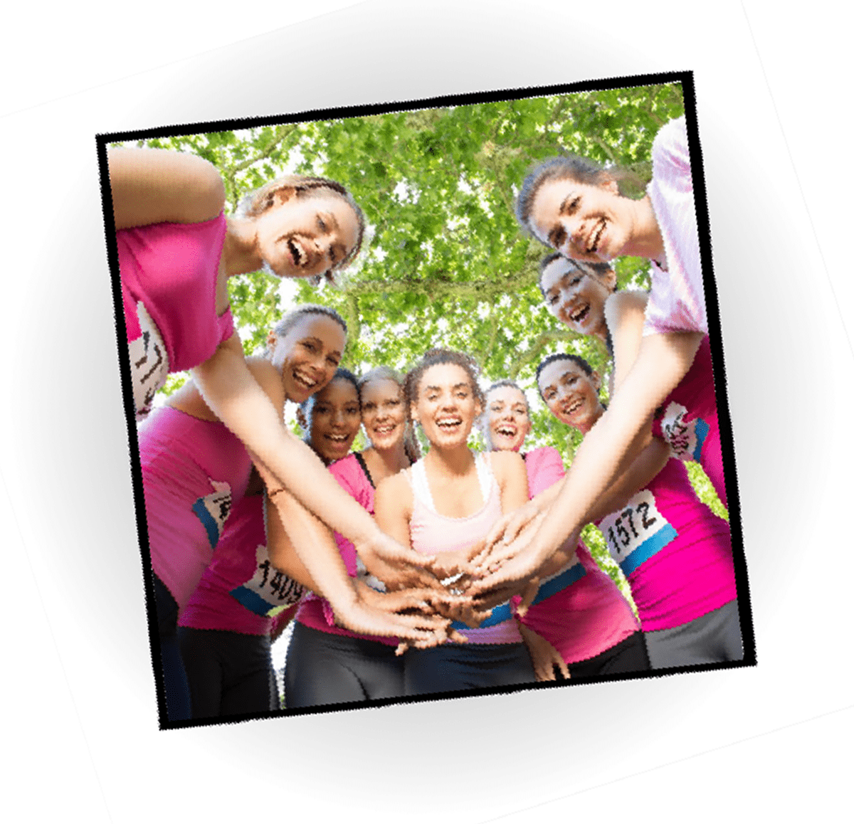 Photo capturing a group of women in pink shirts at a breast cancer awareness event